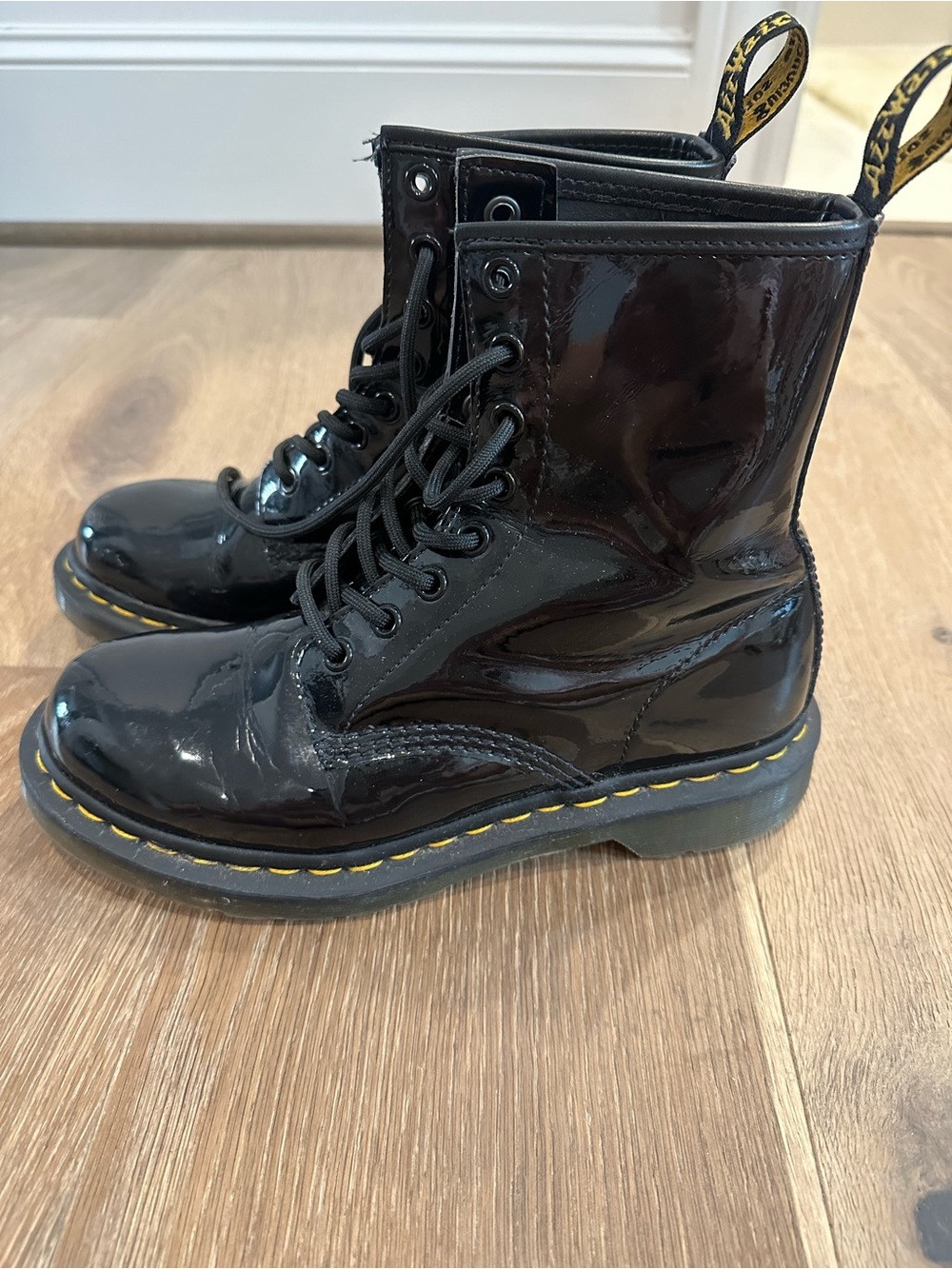 Dr. Martens Black Patent 8-Eye Lace-Up Combat Boots with Yellow Stitching